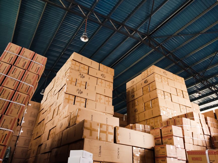 Export cartons being sealed in a warehouse